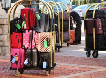 A luggage cart, packed with baggage, much like the baggage we can end up carrying around.