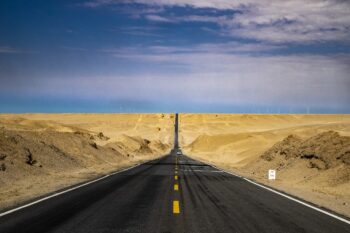 A long straight road, disappearing into the distance, cutting through the desert. Easy to get to where you want to be.