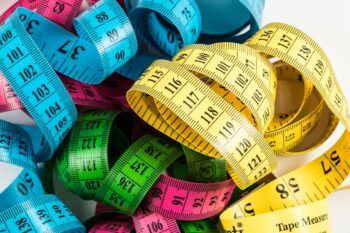 A pile of coloured tape measures. What are you measuring, and how do you define your success?