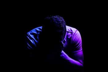 A person, head in. hands, despondent with all that is happening. What do you do to break free?