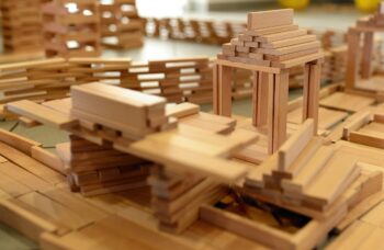 Wooden building blocks, a metaphor for life. We create one step at a time.