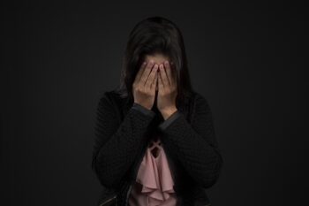 A person holding their head in despair. It doesn't have to be that way - we can always make changes.