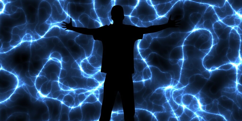 The silhouette of a person, against an electrifying neurological background. It's all about the power of the mind. Create the link between mind, words, and action, and life is better.