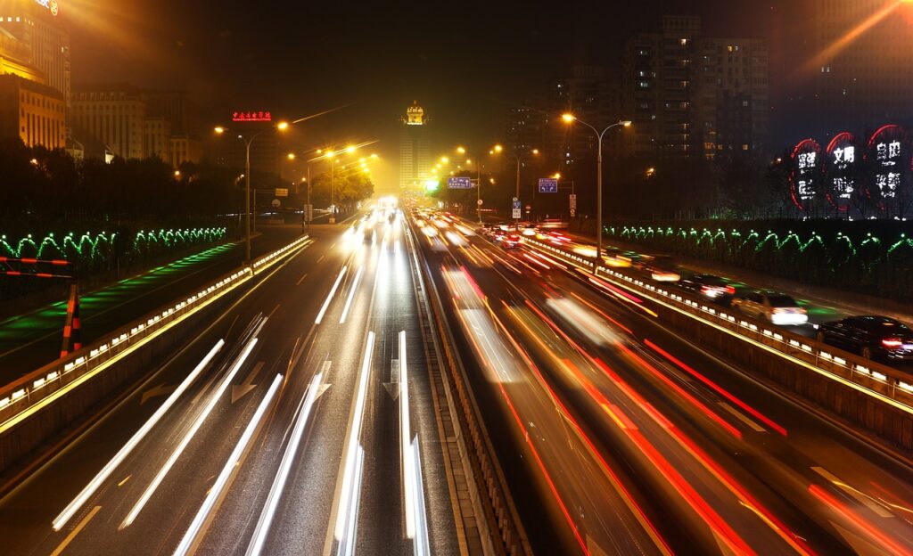 A night time shot of traffic, headlights and rear lights all blurred. Communication is about meaning what you say and saying what you mean.