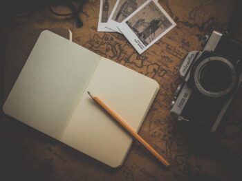 A notebook, photos and a camera. Time to make a plan and make it happen.
