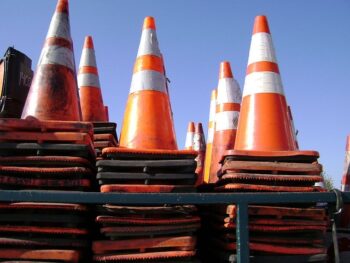 Piles of traffic cones, ready to be set out to create direction