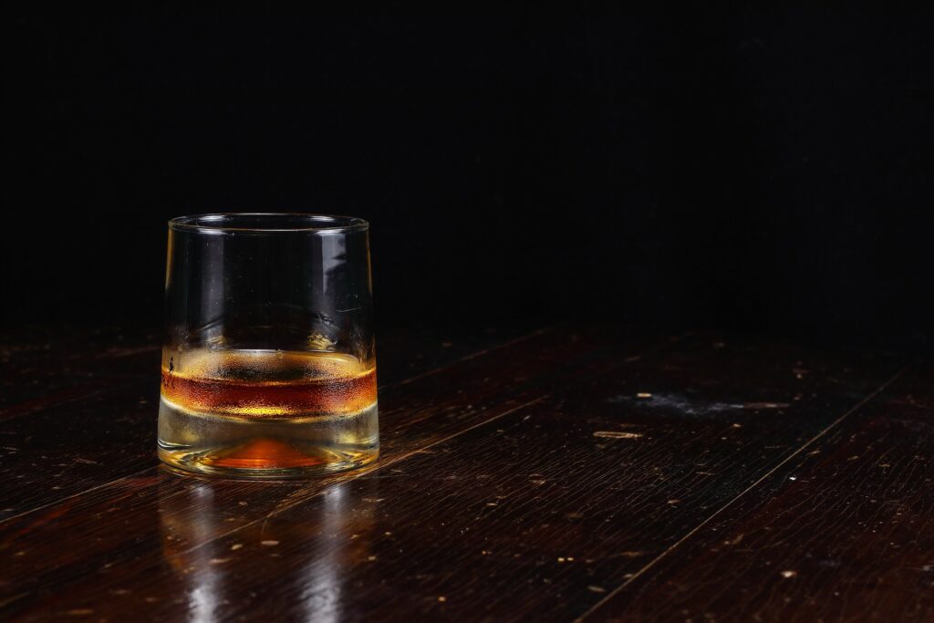 A single glass of whisky. Having fun or out of control? Addiction always starts so well.