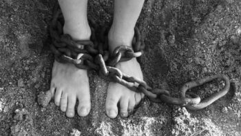 Chains wrapped around someone's ankles. Is this you, chained by your past?