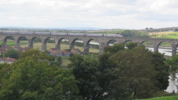 A train on a viaduct, heading in the right direction.