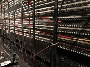 An old-fashioned switchboard, cables crossed