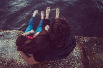 Two people hugging, supporting each other in kindness