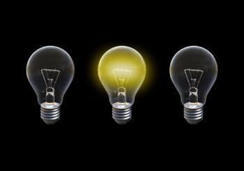 Three light bulbs, the one in the middle alight. What bright ideas are you having today?