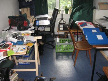 A messy room, things everywhere, disorganised and not looked after.